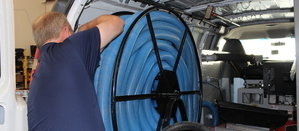 Water Damage Restoration Technician Prepping Suction Hoses