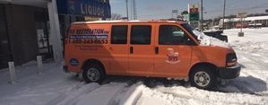 Water Damage Restoration Van In Snow At Commerical Job Site